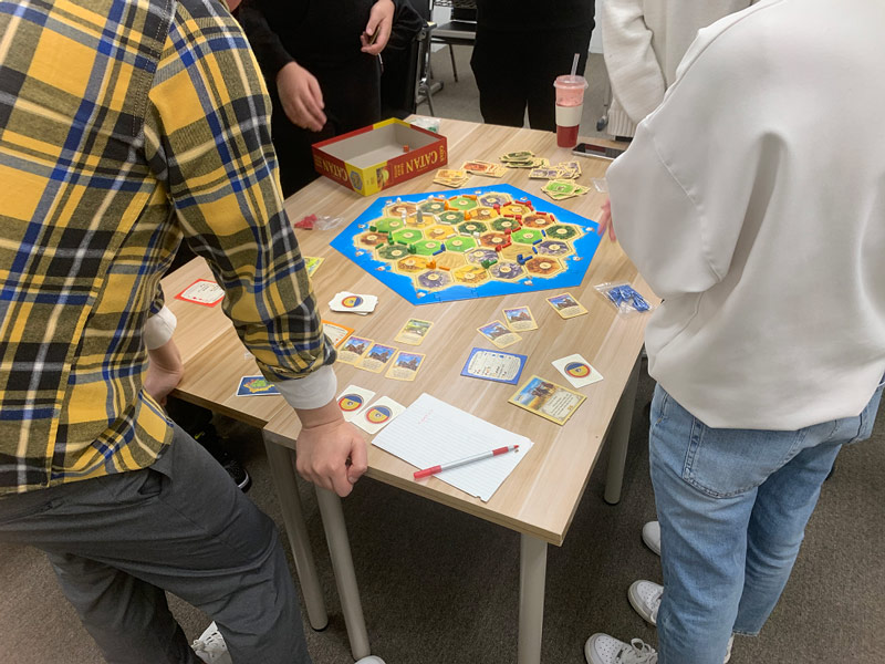A class enjoying a game of Cata
